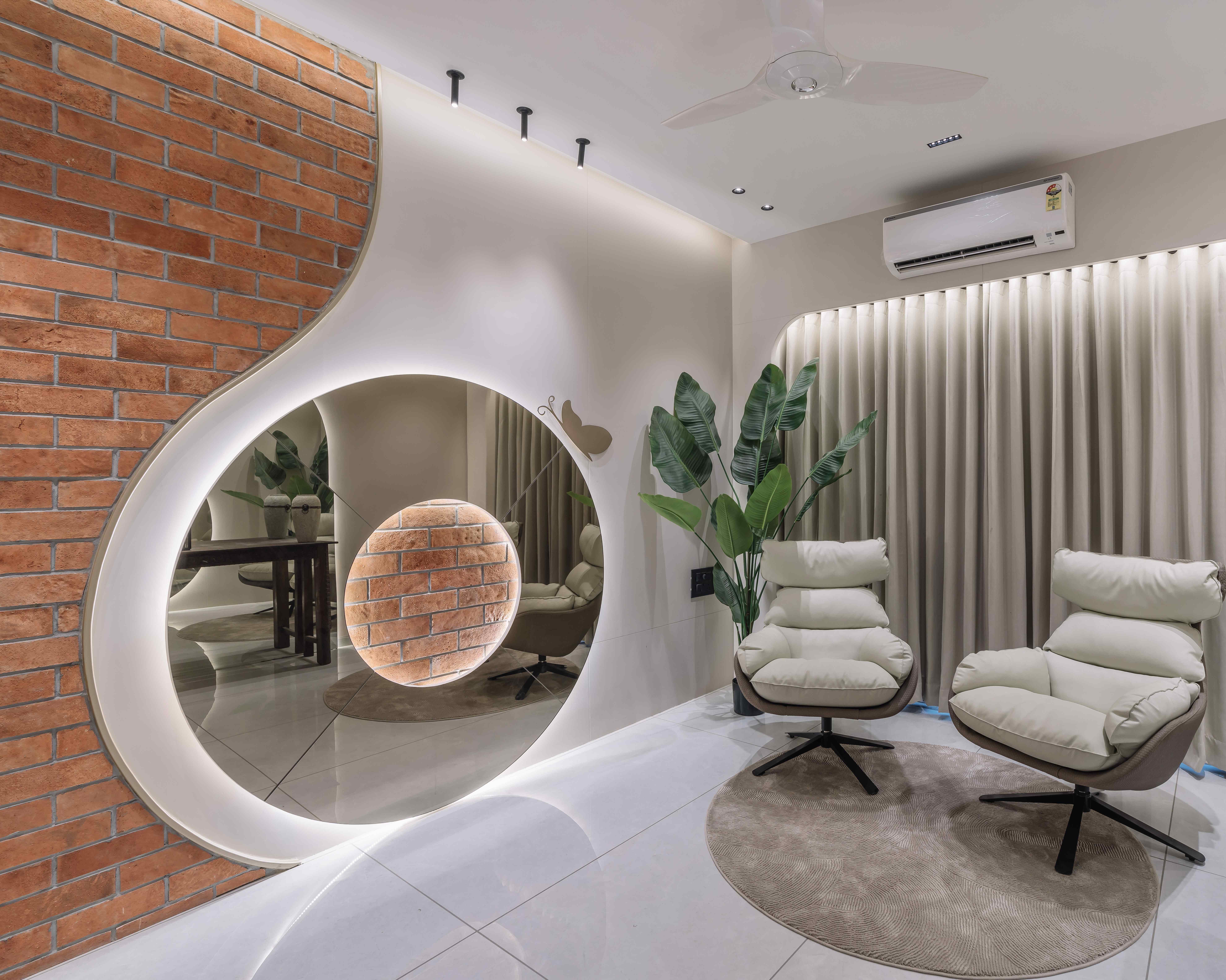Bansari Prominance interior with curved wall design, brick texture and contemporary seating